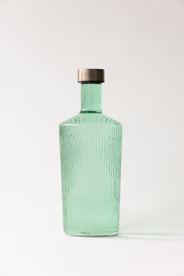 Groene-glazen-fles-met-ribbels-en-draaidop-paveau verkocht door Anneke Crauwels Home